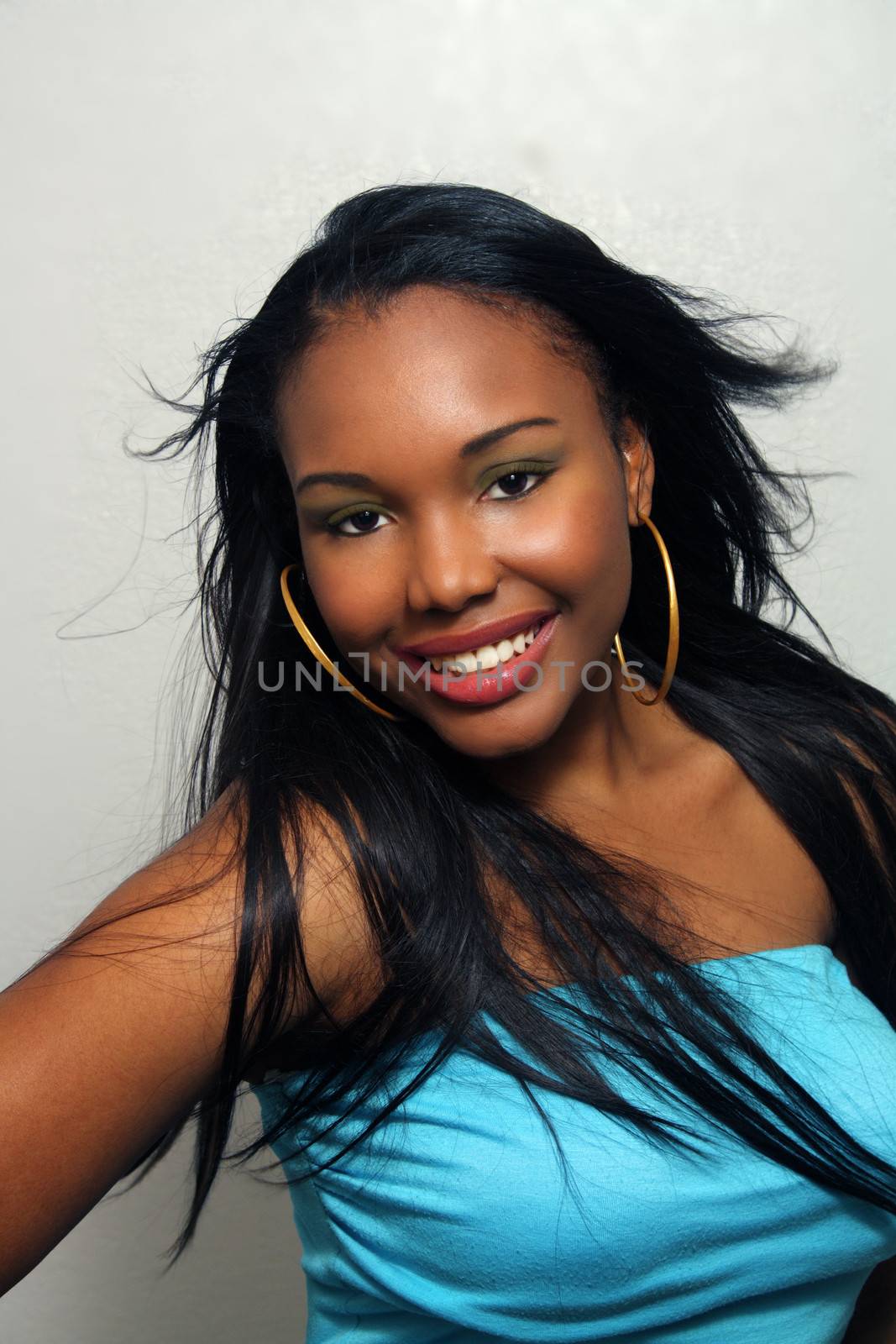 A close-up of a lovely young Haitian girl with a captivating smile.