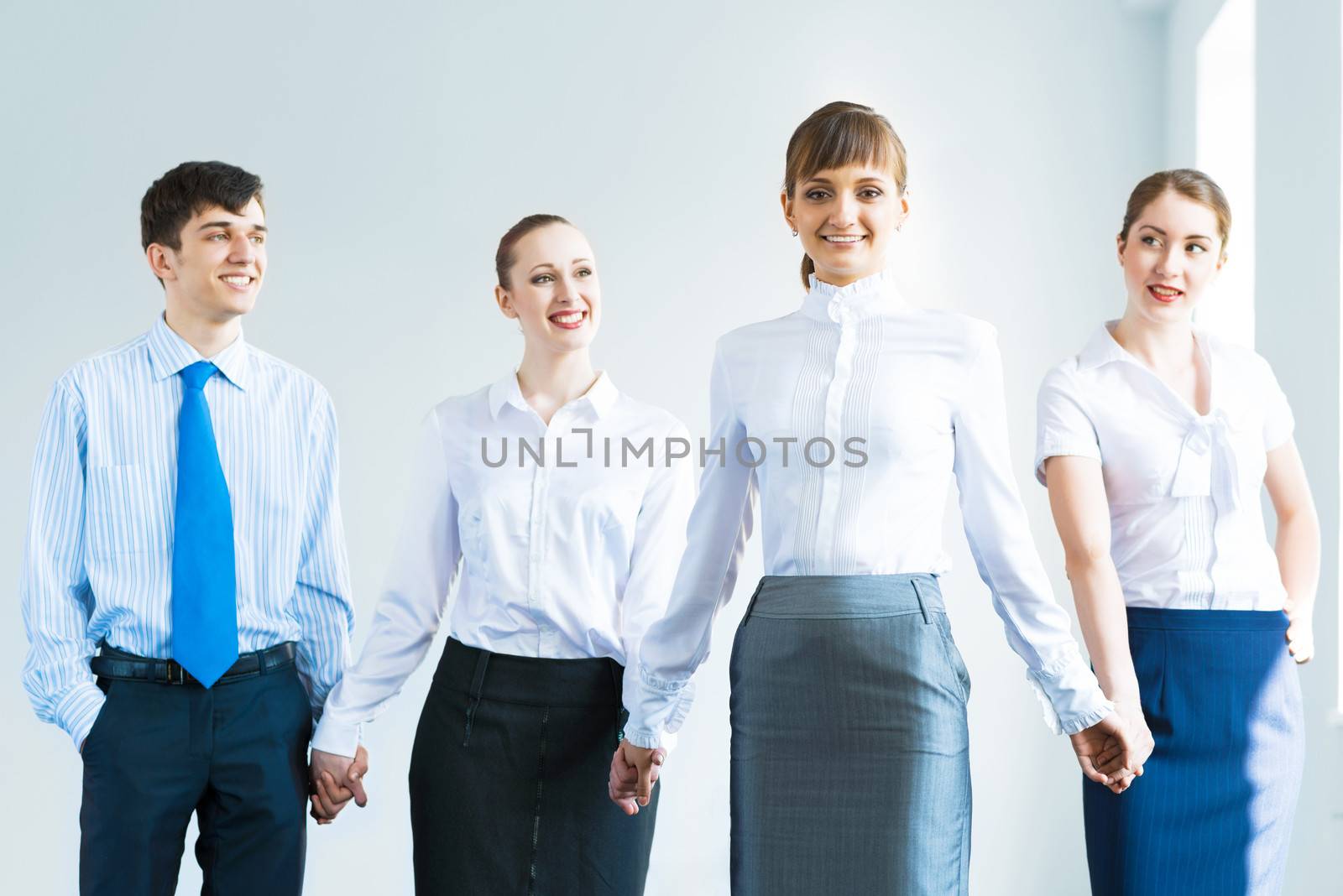 leadership team, a group of business people standing in a number of hand-in-hand, the leader stepped forward