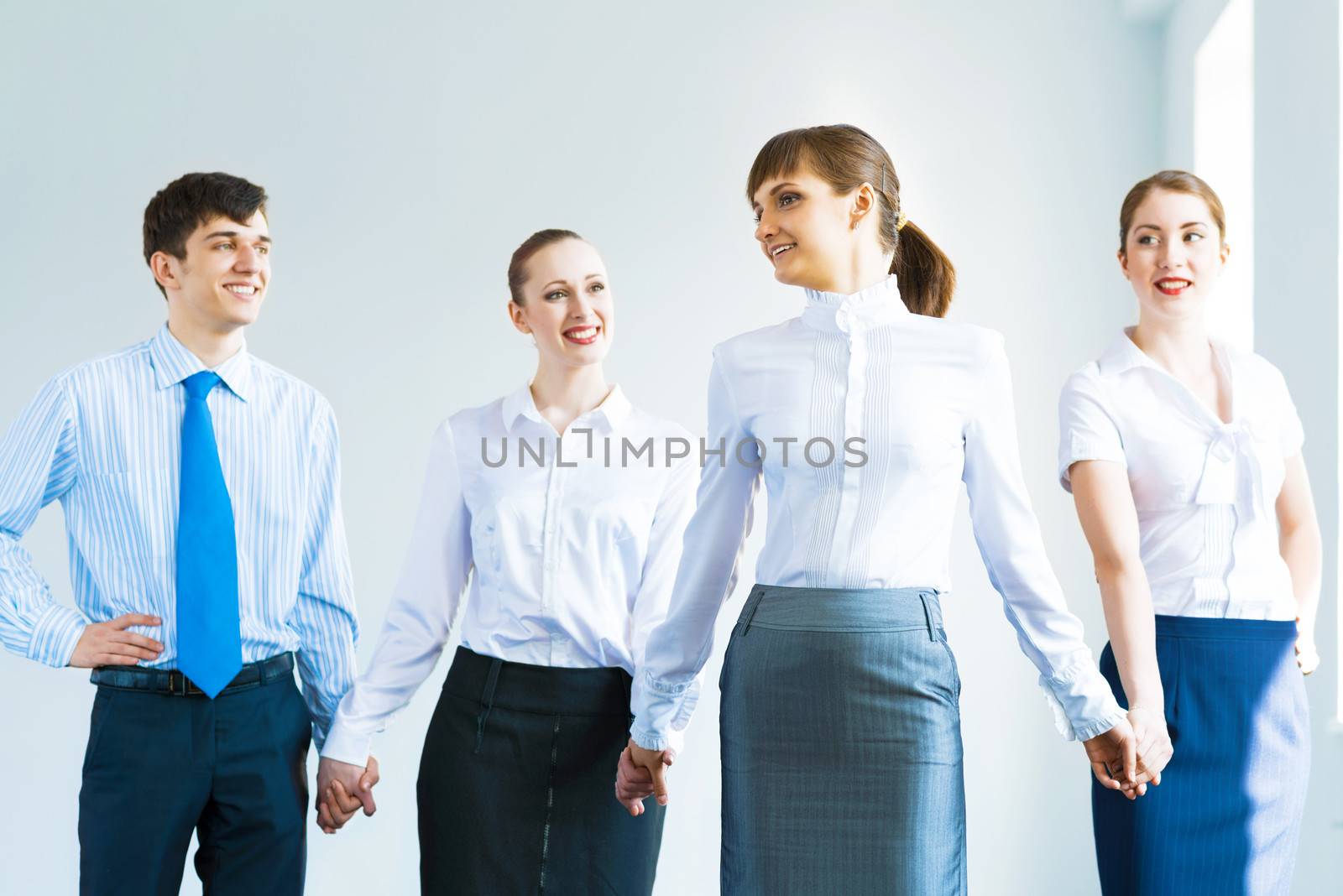 leadership team, a group of business people standing in a number of hand-in-hand, the leader stepped forward