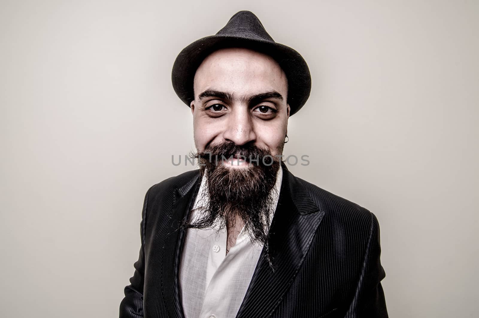 long beard and mustache hipster with elegant suit 