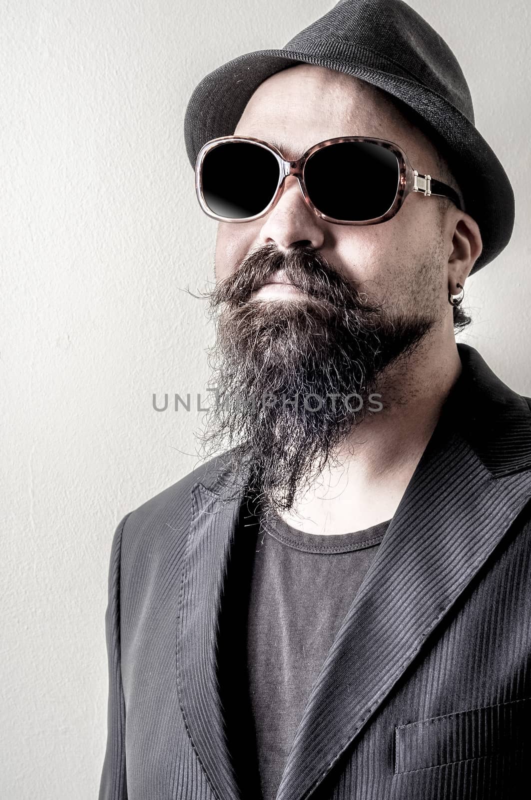 long beard and mustache hipster with elegant suit 