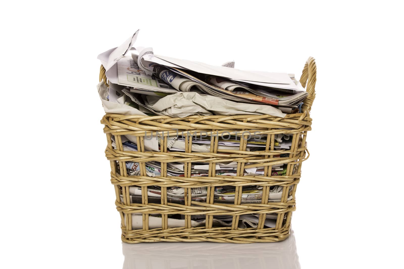 Full wastepaper basket isolated on white background