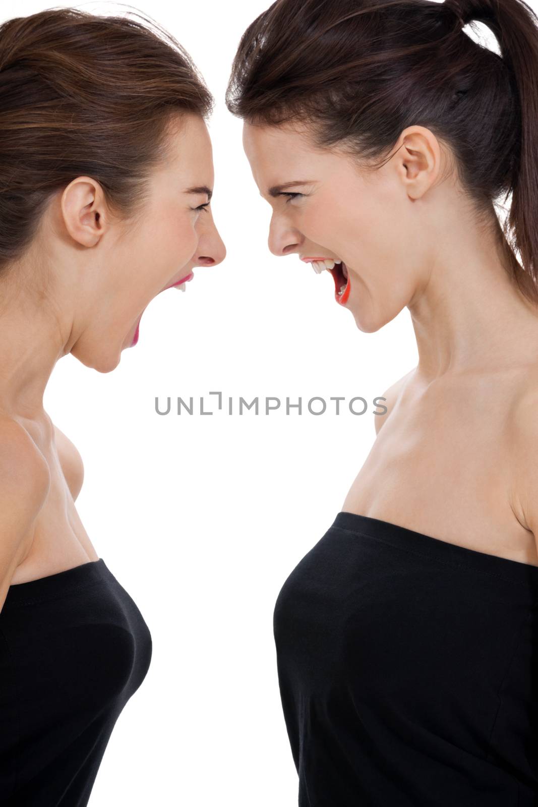 two young girls angry shouting loud isolated on white background