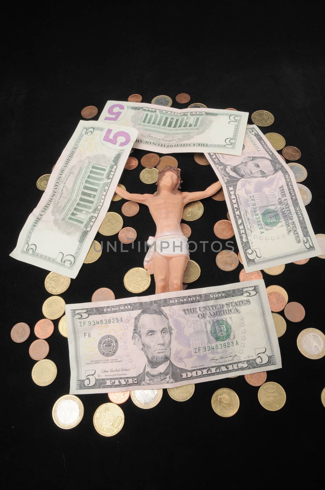 Jesus Christ and Money on a Dark Background - Religion Concept