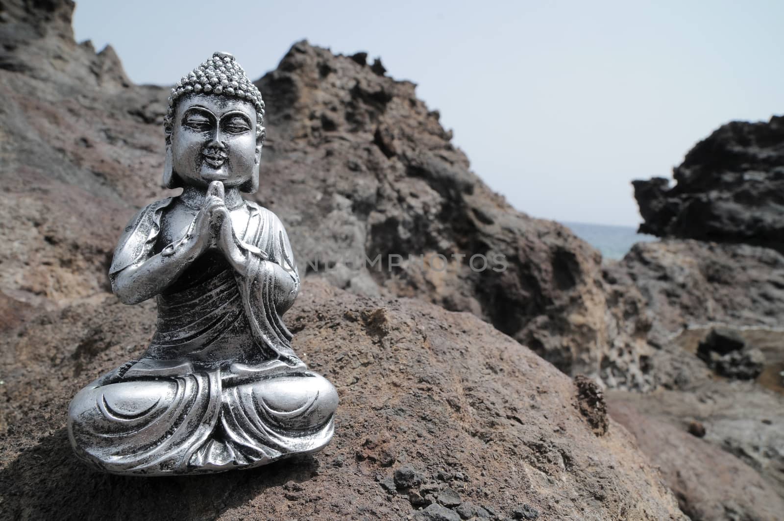 One Ancient Gray Buddha Statue Near The Ocean