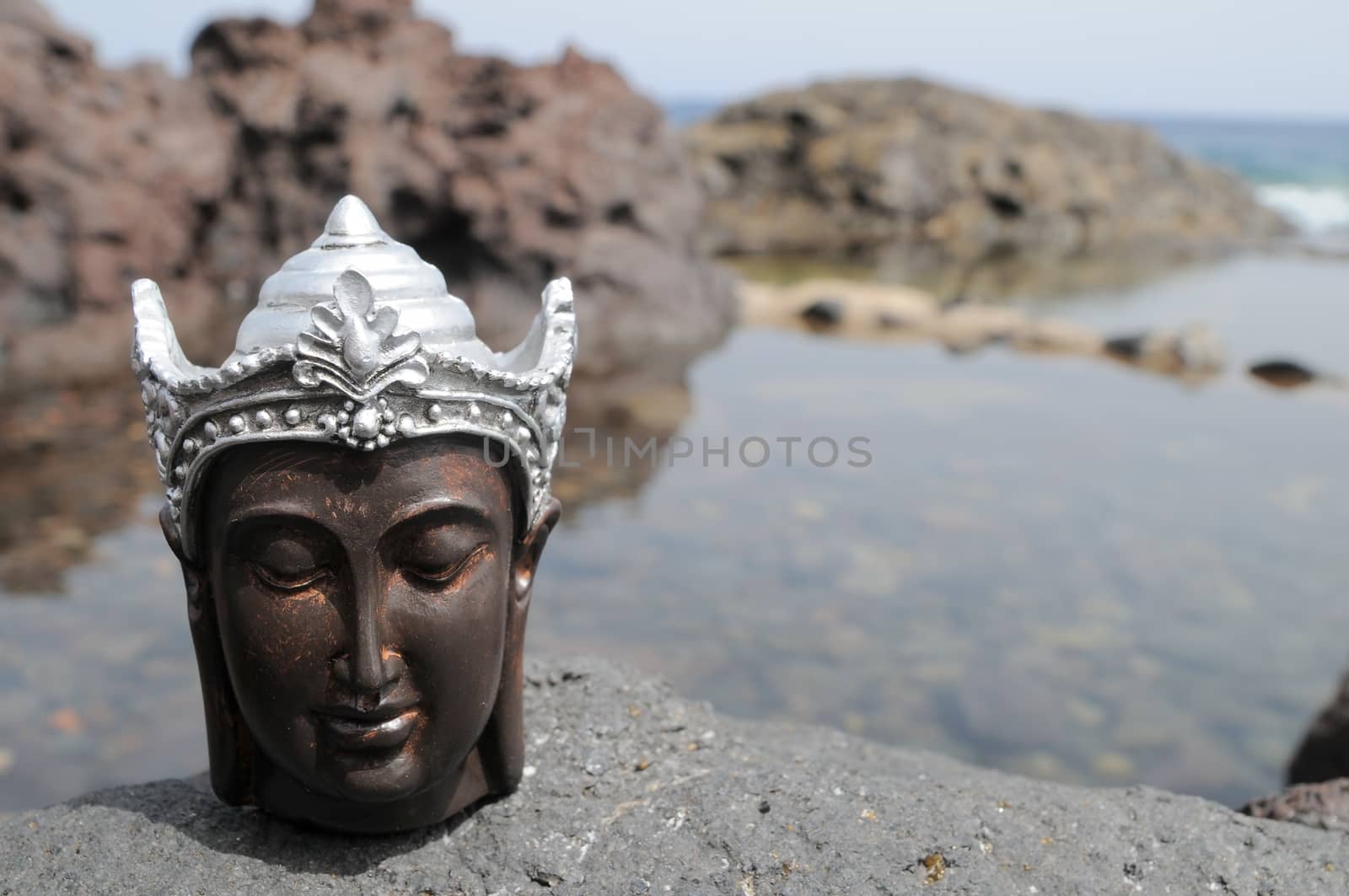 One Ancient Gray Buddha Statue Near The Ocean