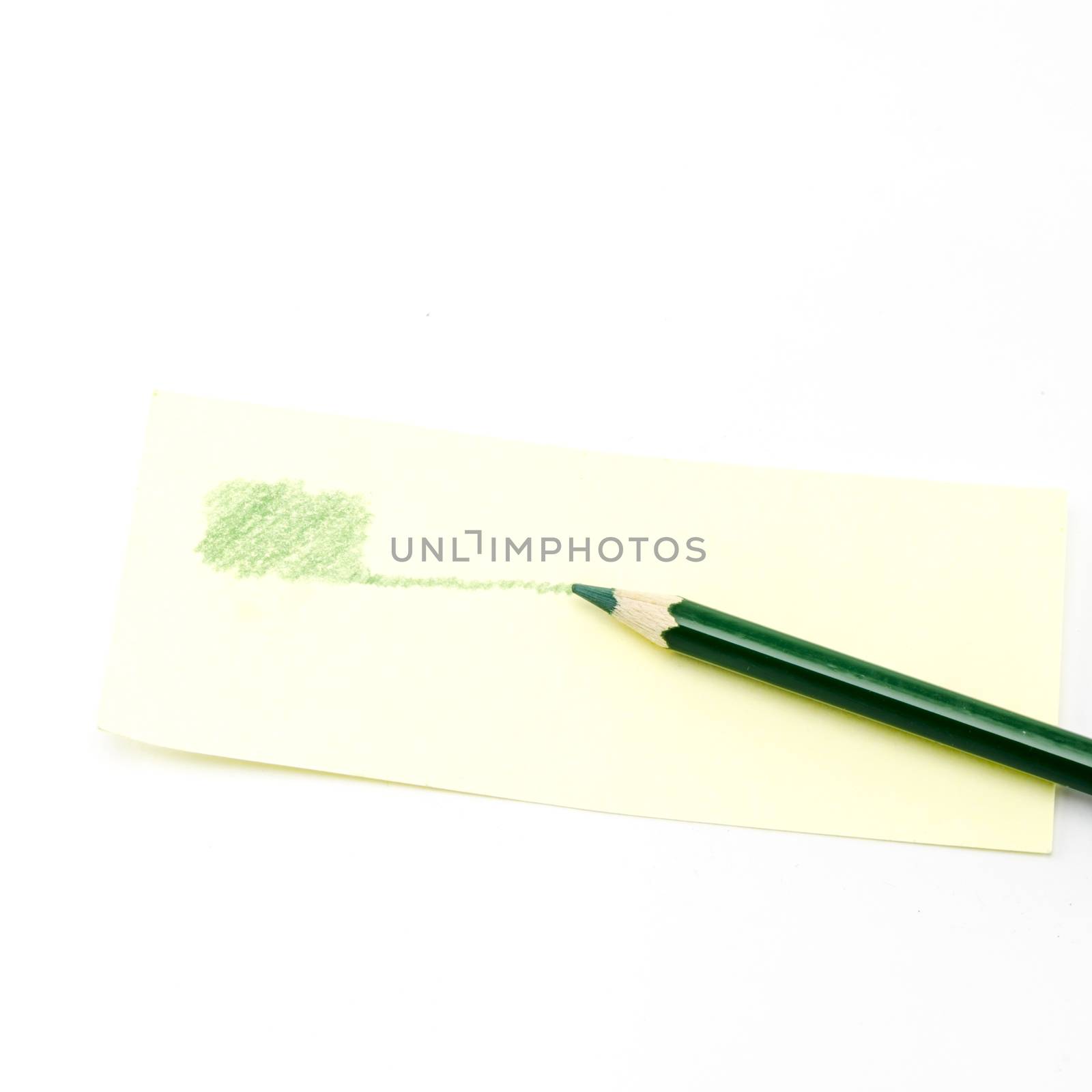 green pencil isolated on white by ammza12
