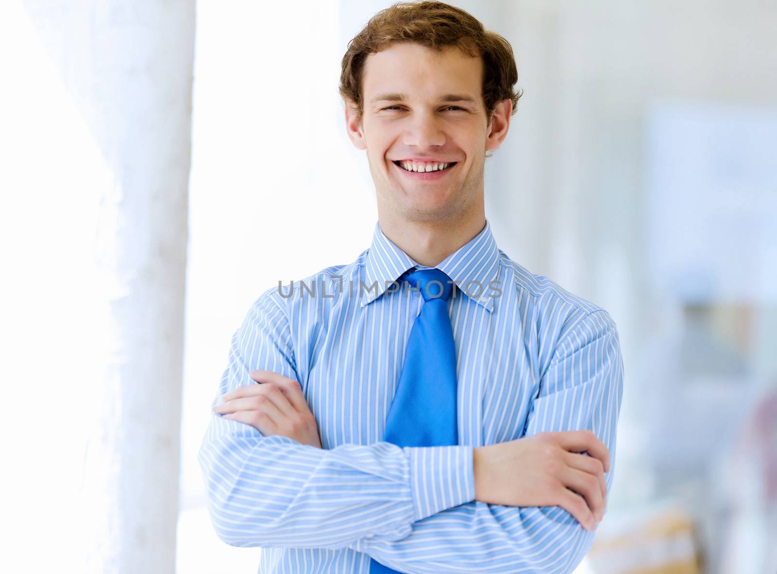 Image of young handsome confident businessman in suit