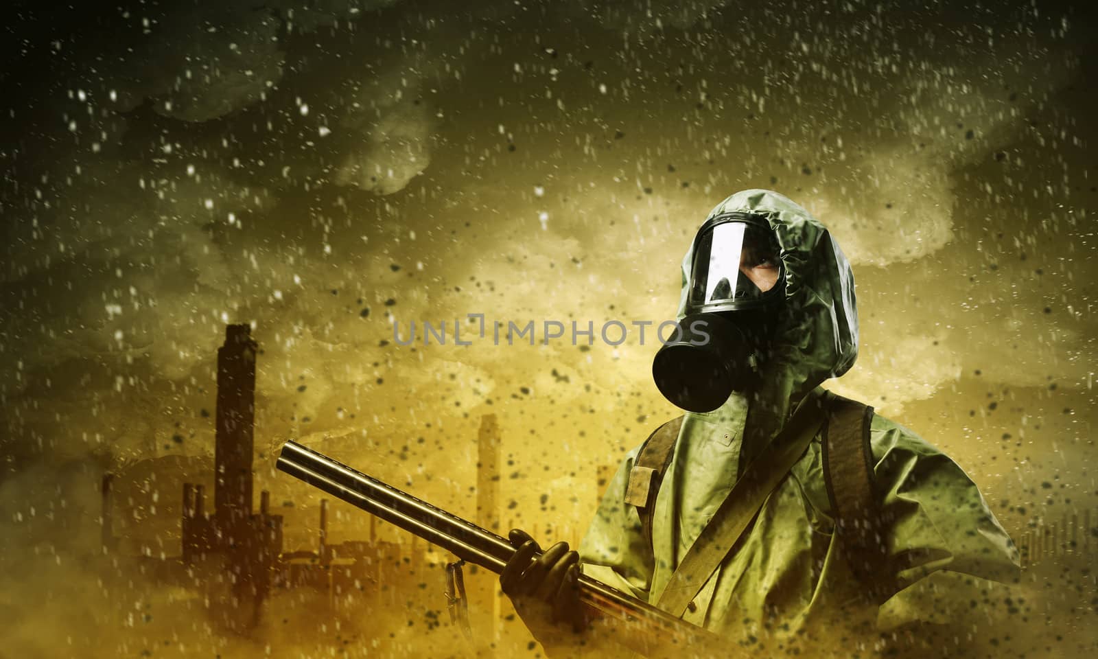 Man in gas mask and camouflage holding gun. Disaster concept