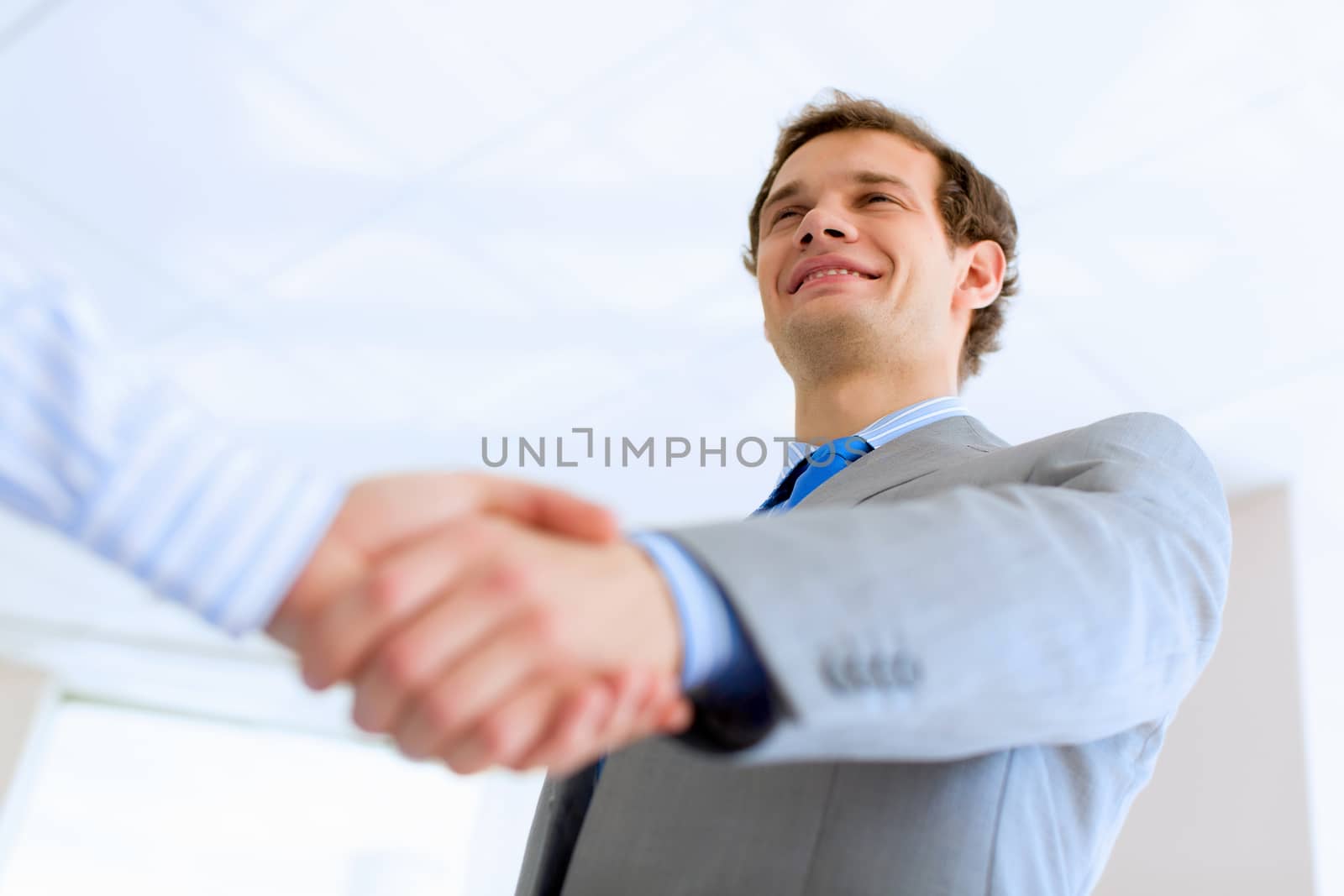 Close up image of business handshake at meeting. Partnership concept