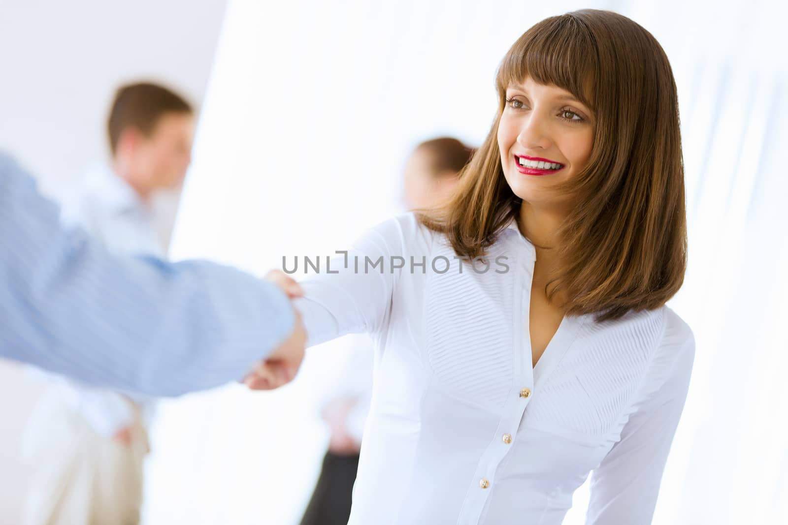 Image of businesswoman greeting colleague. Partnership concept