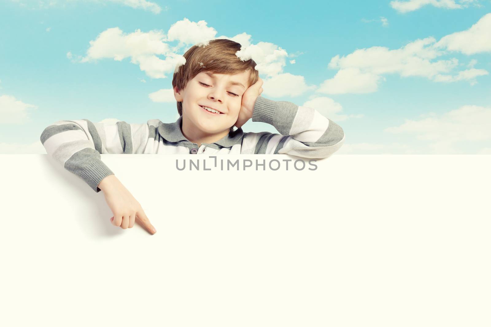 Little boy holding a blank white billboard