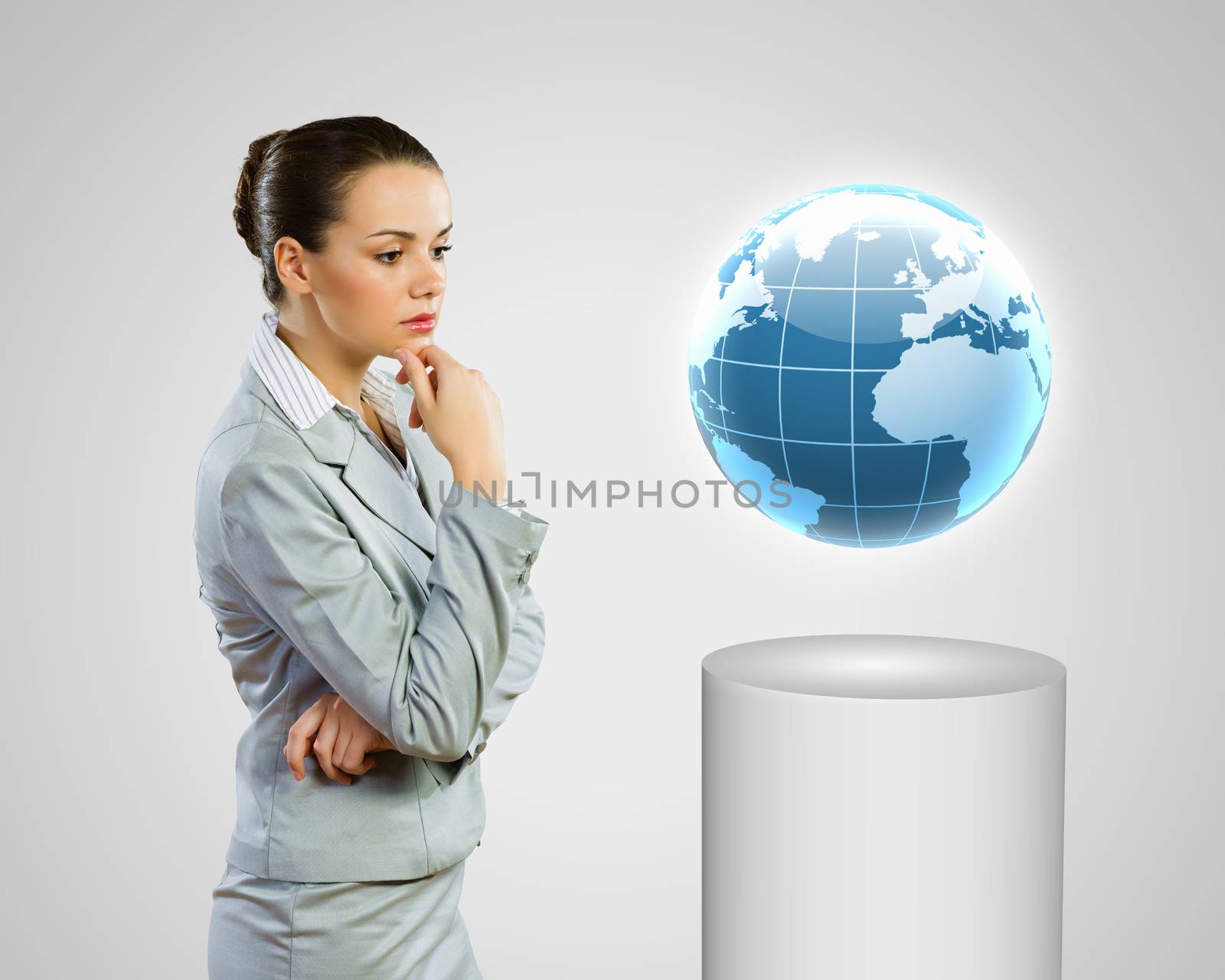 Image of thoughtful businesswoman looking at globe