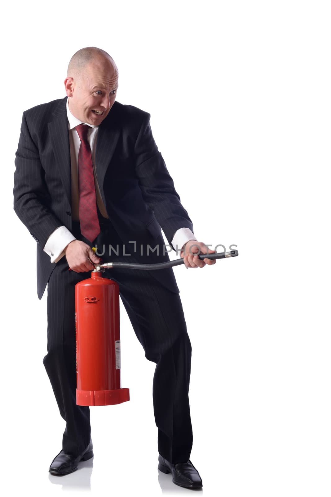 Businessman with fire extinguiser isolated on white. concept of putiing out fires resolving problems in buisness.