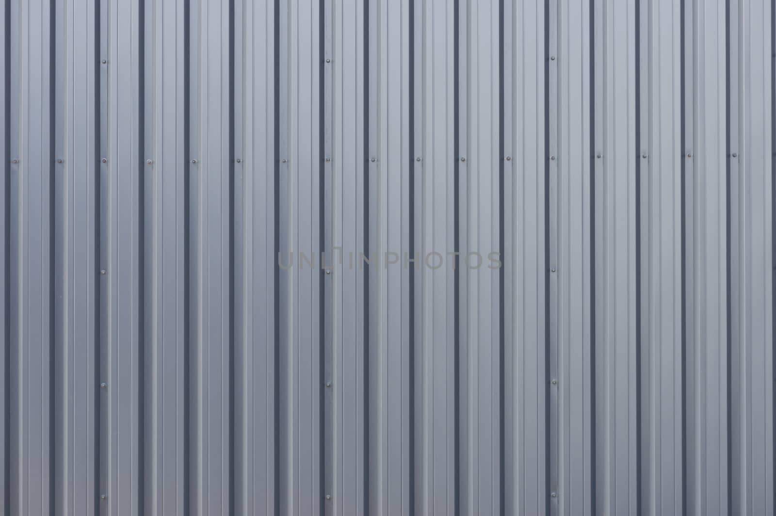 Grey corrugated steel cladding on a industrial building 