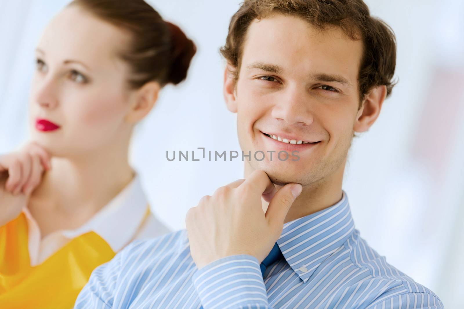 Image of businessman and businesswoman smiling joyfully