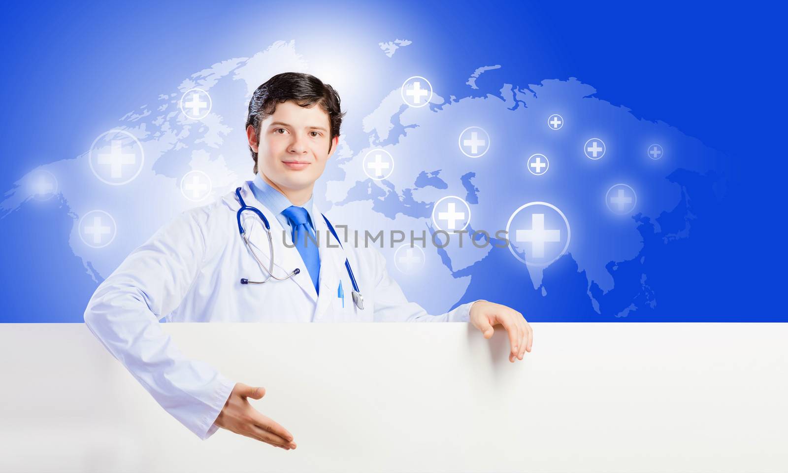 Image of handsome doctor holding white blank banner