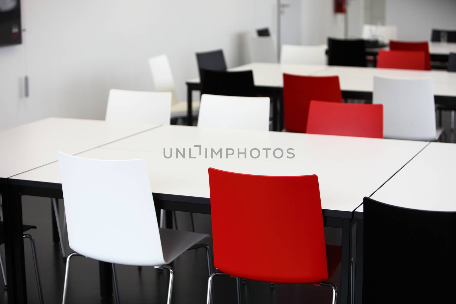 Empty red and white tables and chairs by Farina6000