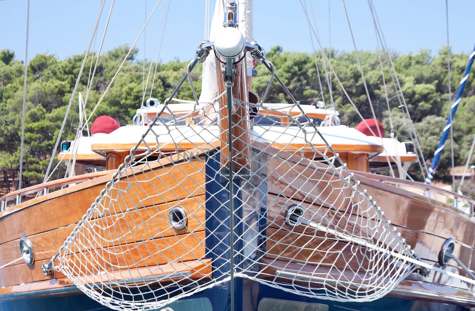 modern wooden ship anchored in harbor 