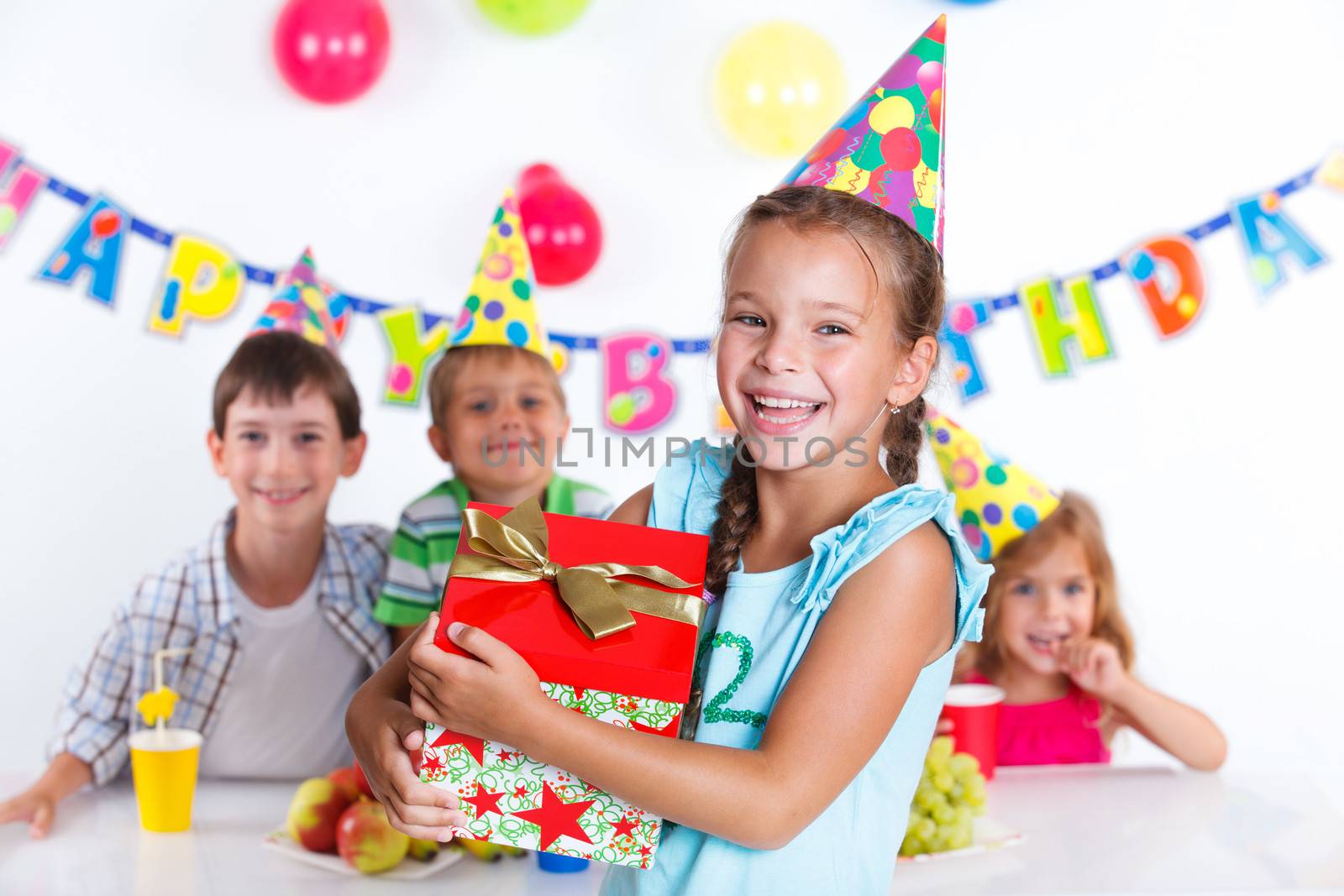 Girl with giftbox at birthday party by maxoliki