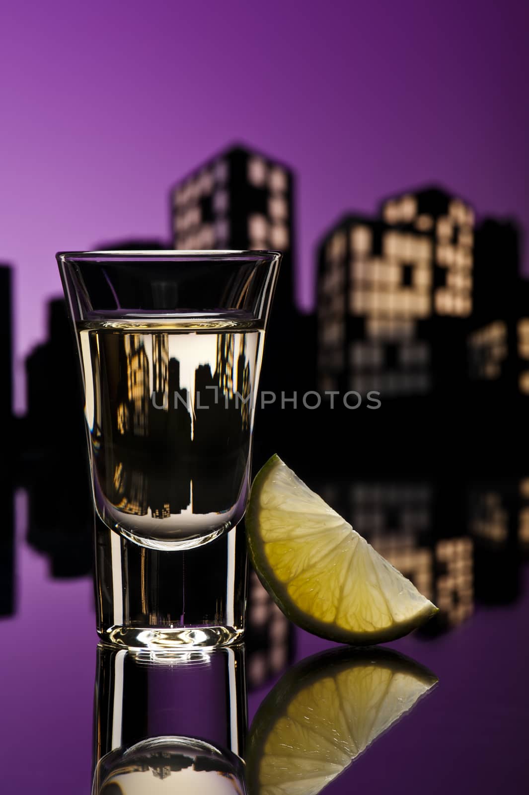 Tequila shoot in colorfull cityscape setting