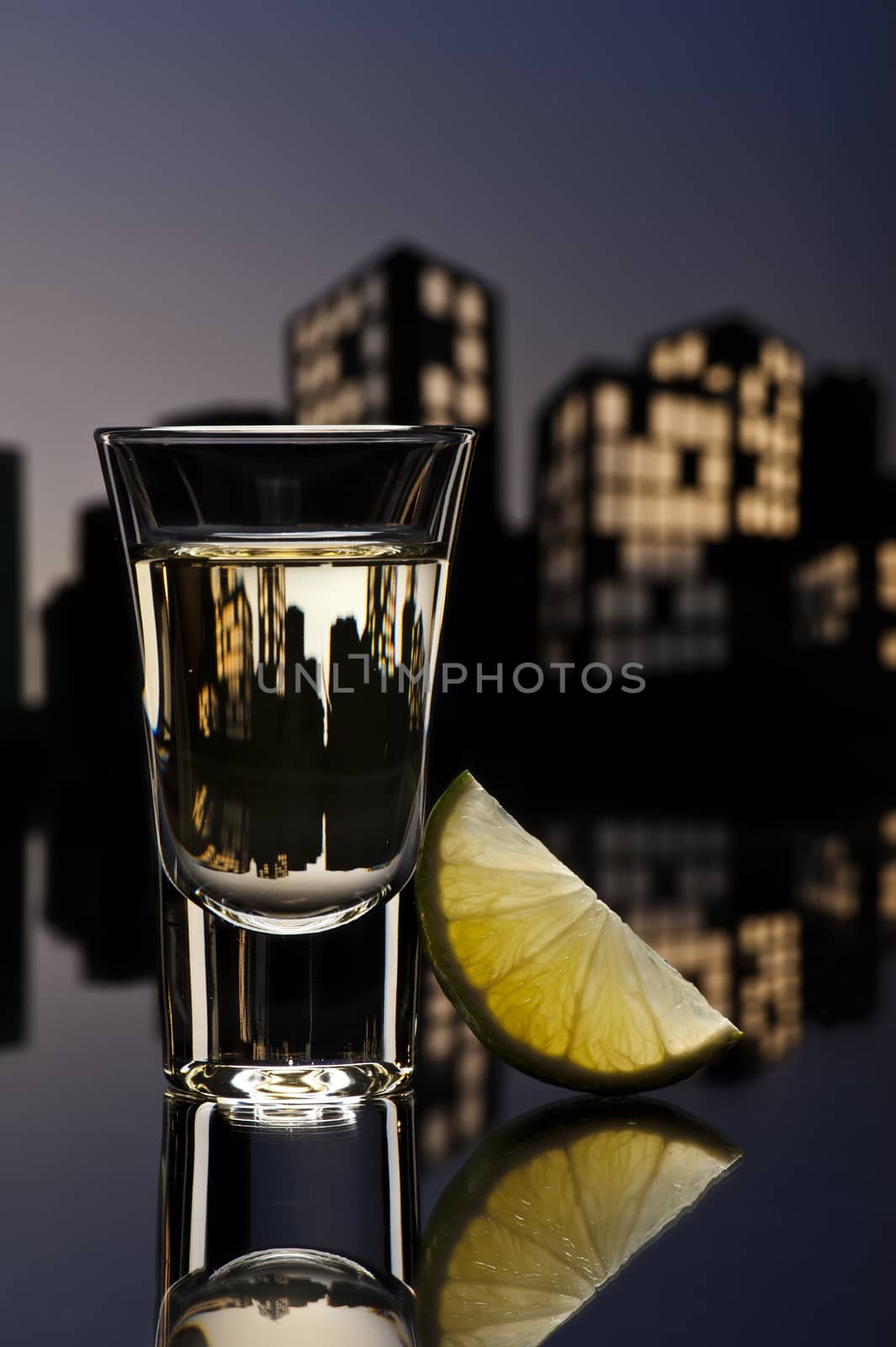 Tequila shoot in colorfull cityscape setting