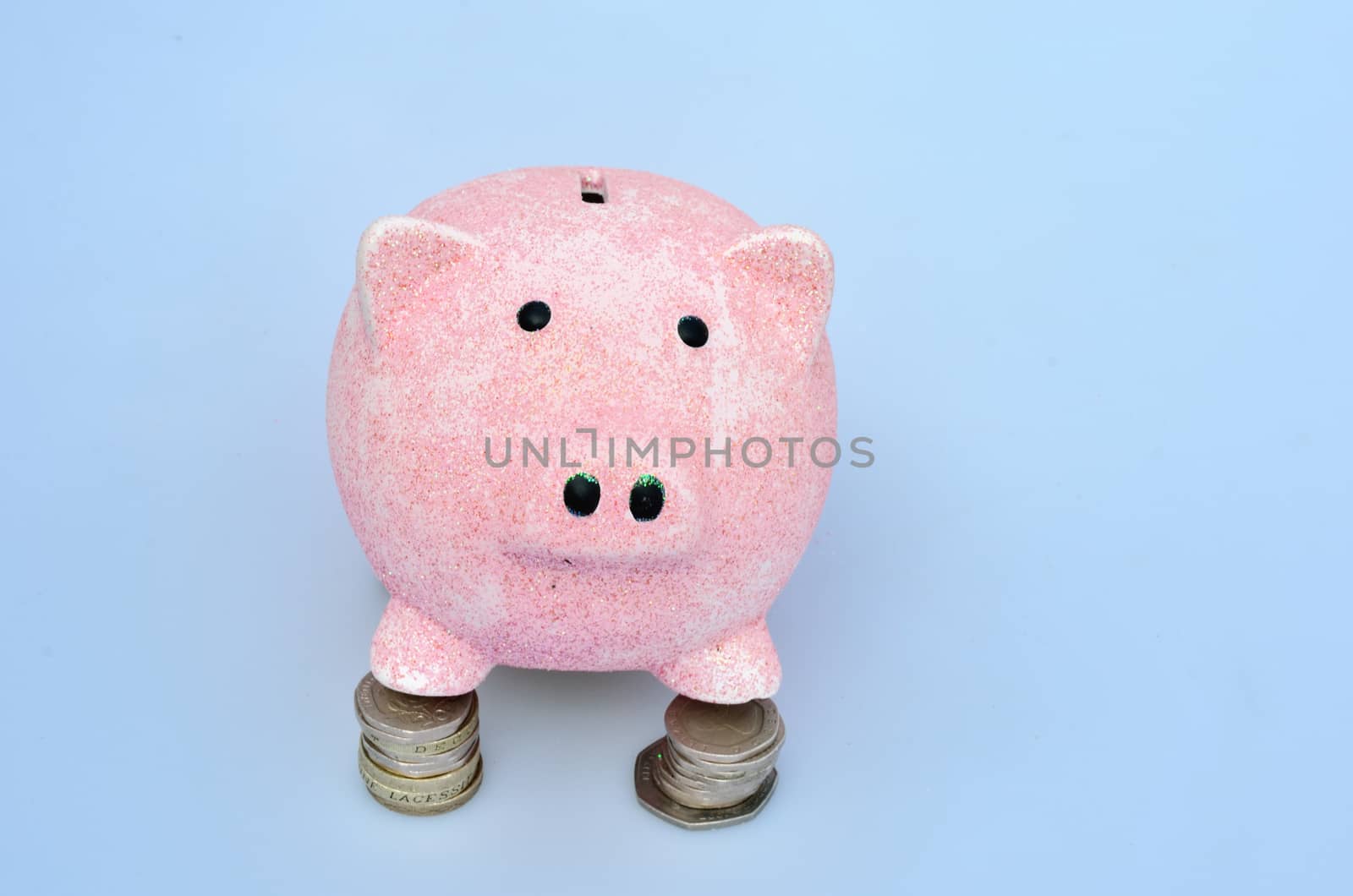 Piggy Bank standing on coins