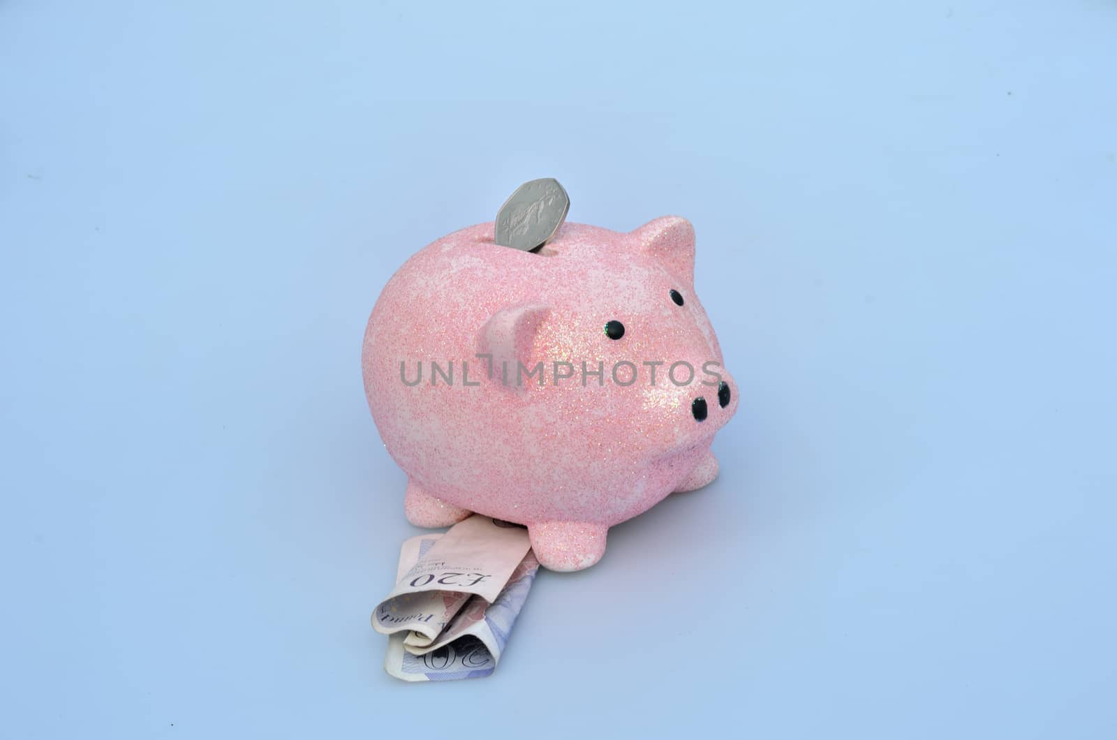 Piggy bank with coin and notes