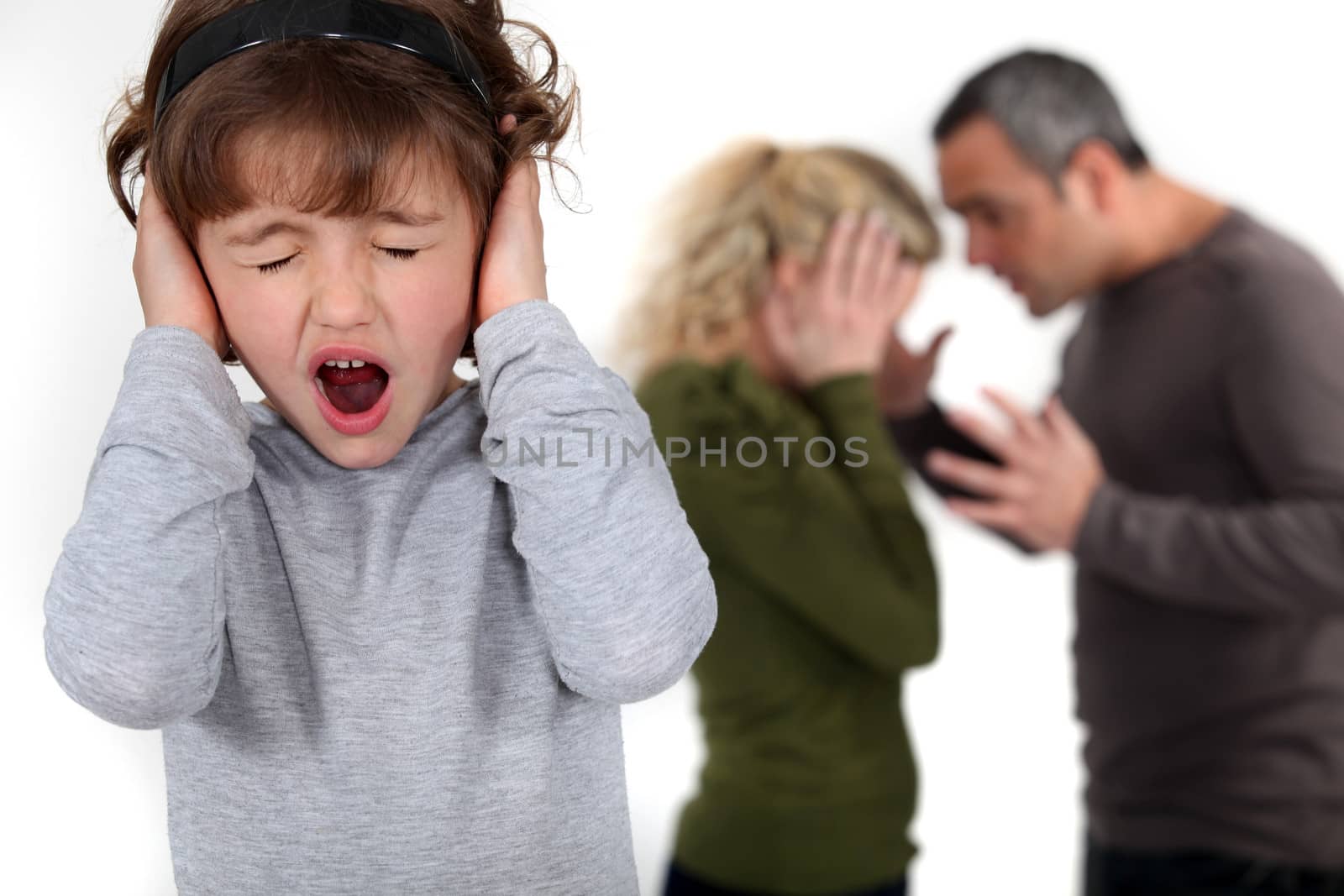 Young child trying to block out her parents' argument Lacrouts_Isabelle_230311,Paniandy_Eric_230311,Armand_Lea_230311