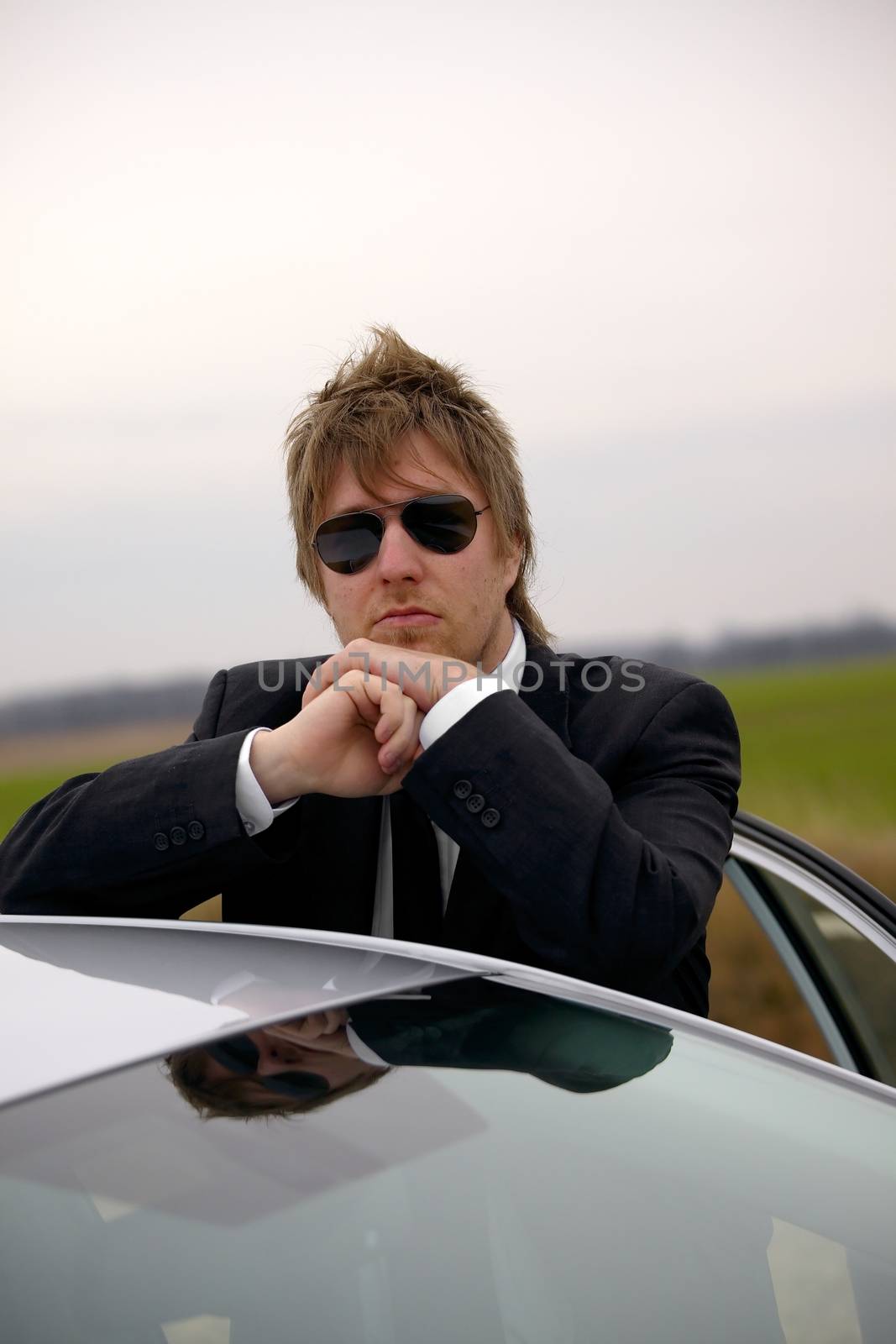 Driver of a car standing and waiting