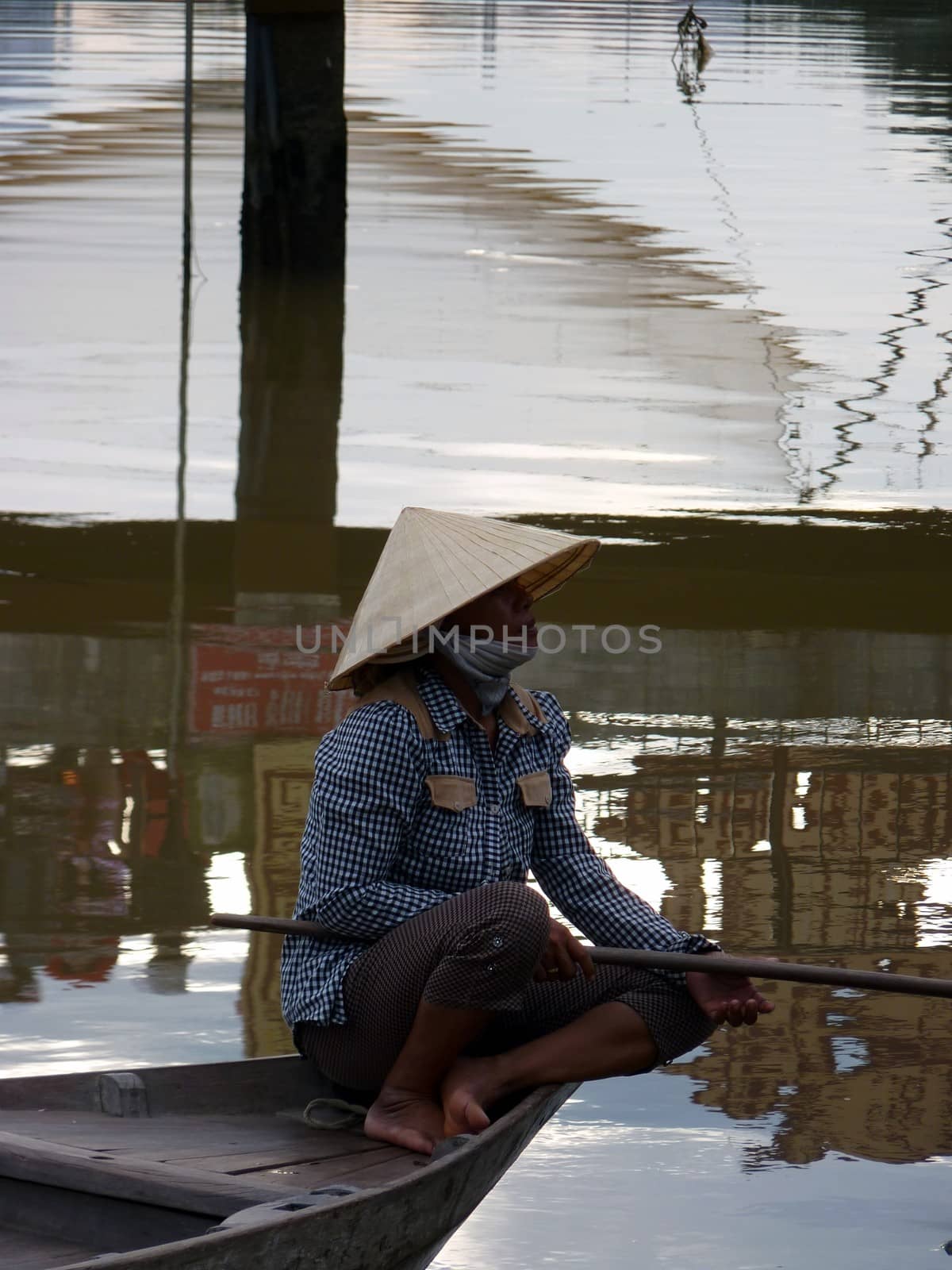 Woman fishing in Hoi An, Vietnam