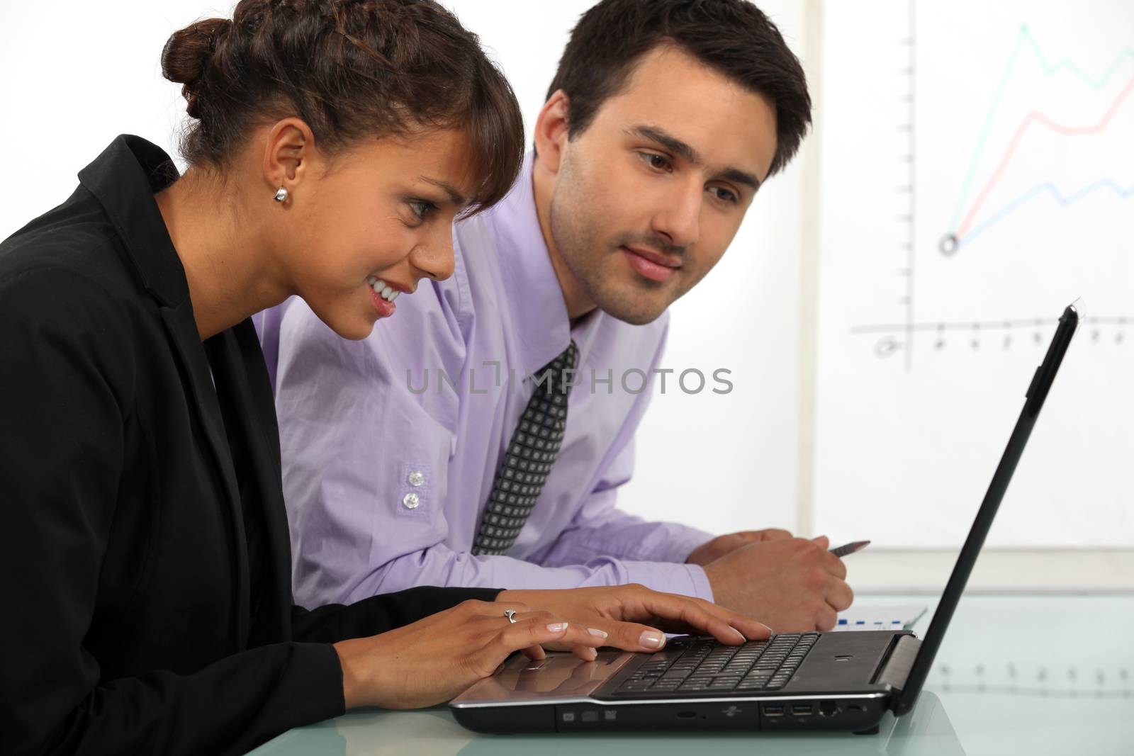 young businessman and businesswoman working together