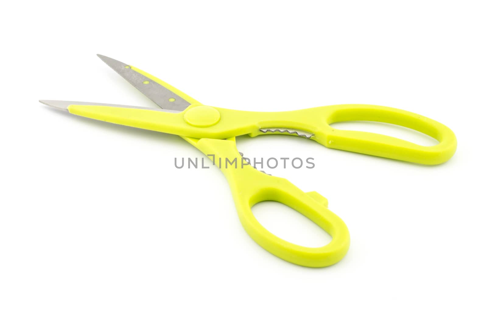 green scissors isolated on white background by ammza12