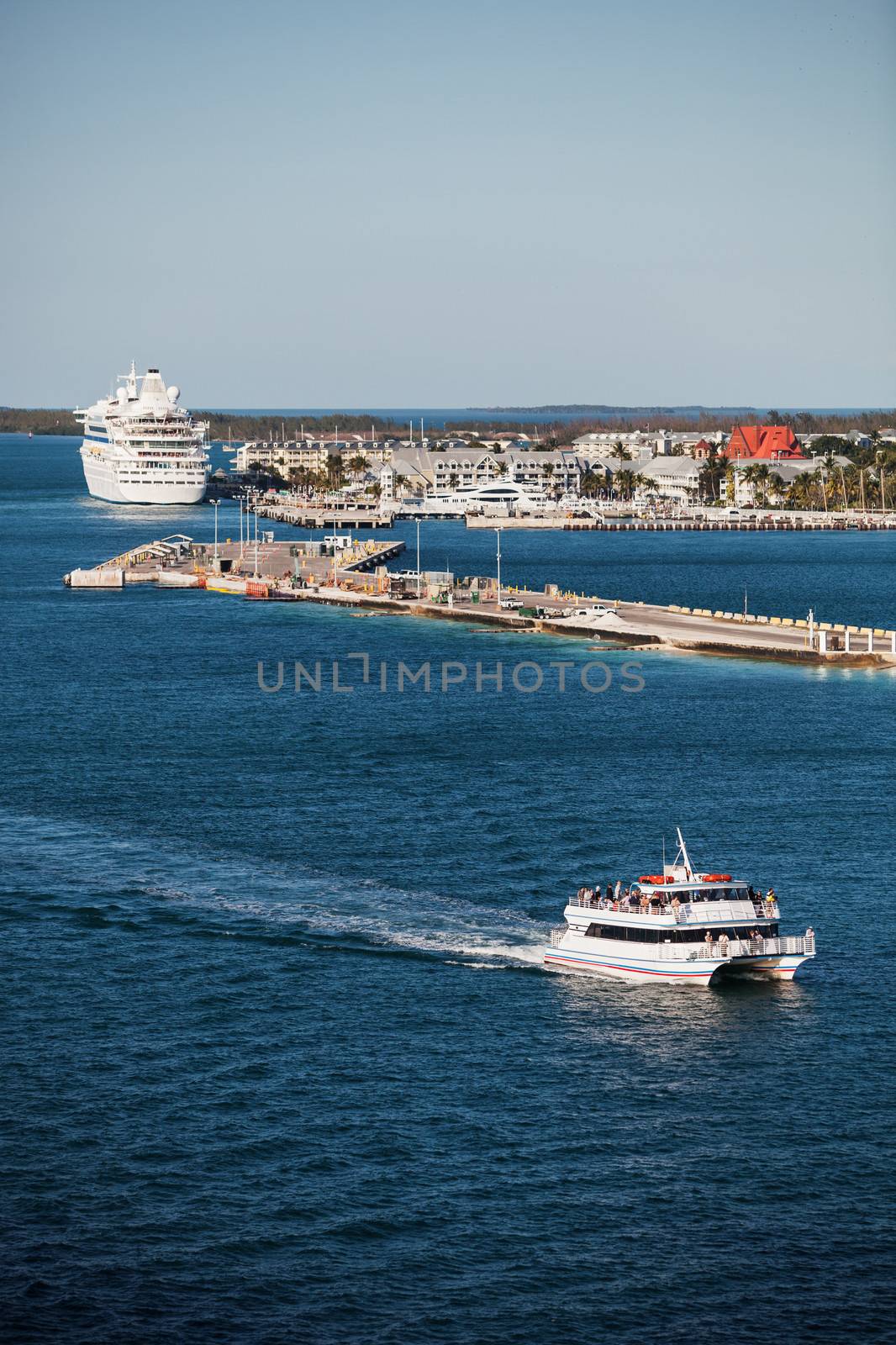 Key West port with cruise ship and tourist catmaran boat