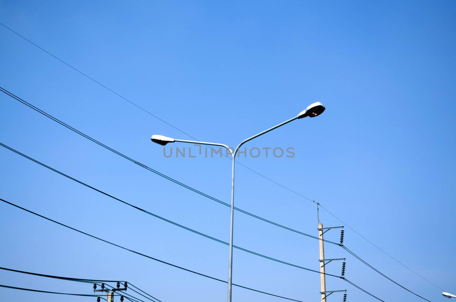 street light and Electricity post on blue sky by ammza12