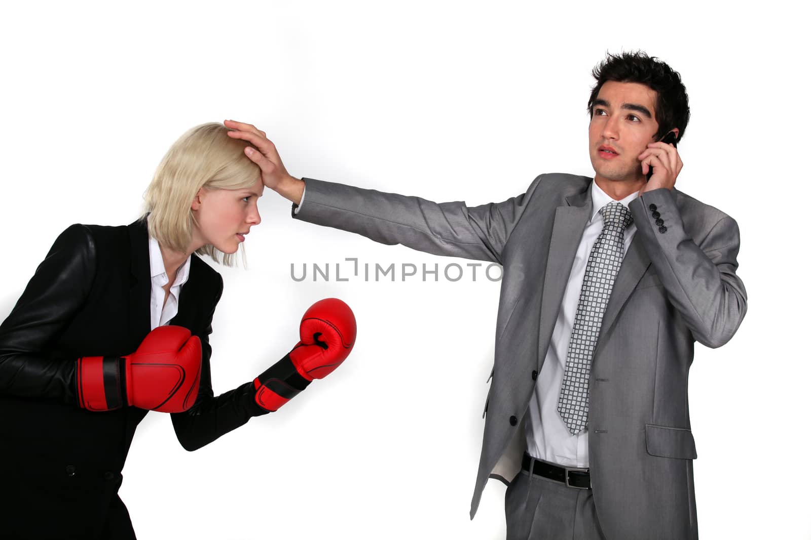 businesswoman with boxing gloves and male colleague on the phone Peyruse_Boroffka_Lea_220311,Jesus_Michael_220311