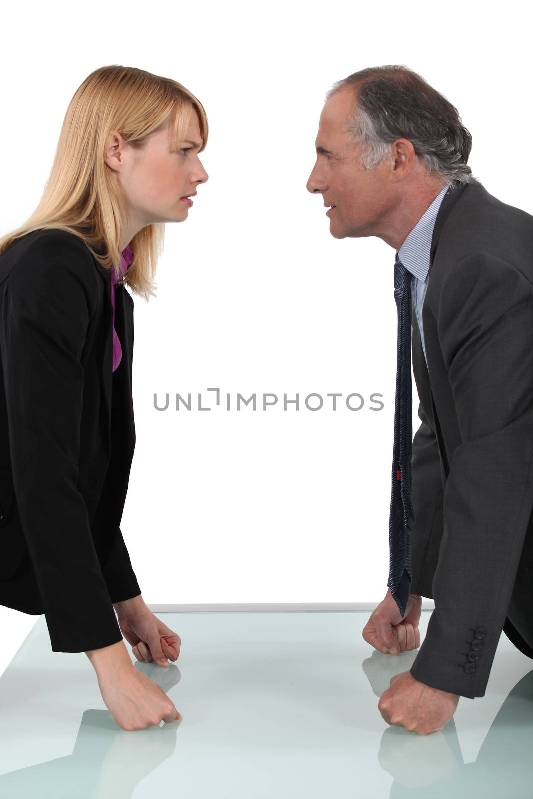 businessman and businesswoman having a quarrel by phovoir
