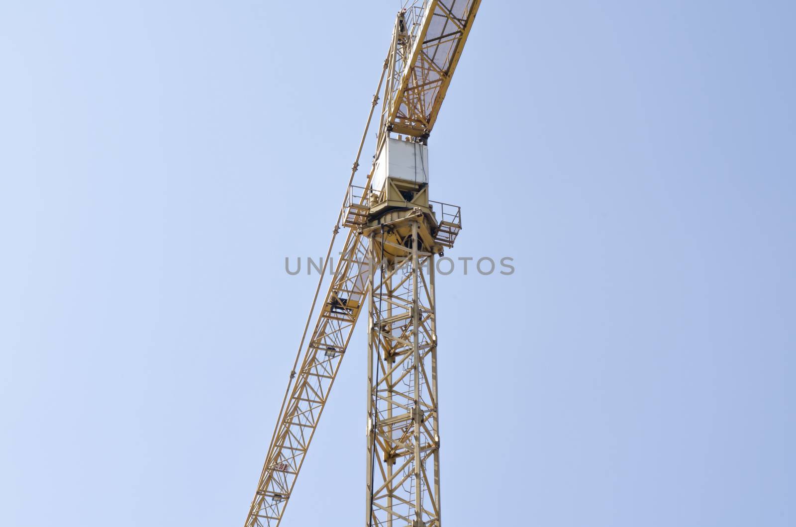 crane on blue sky background by ammza12