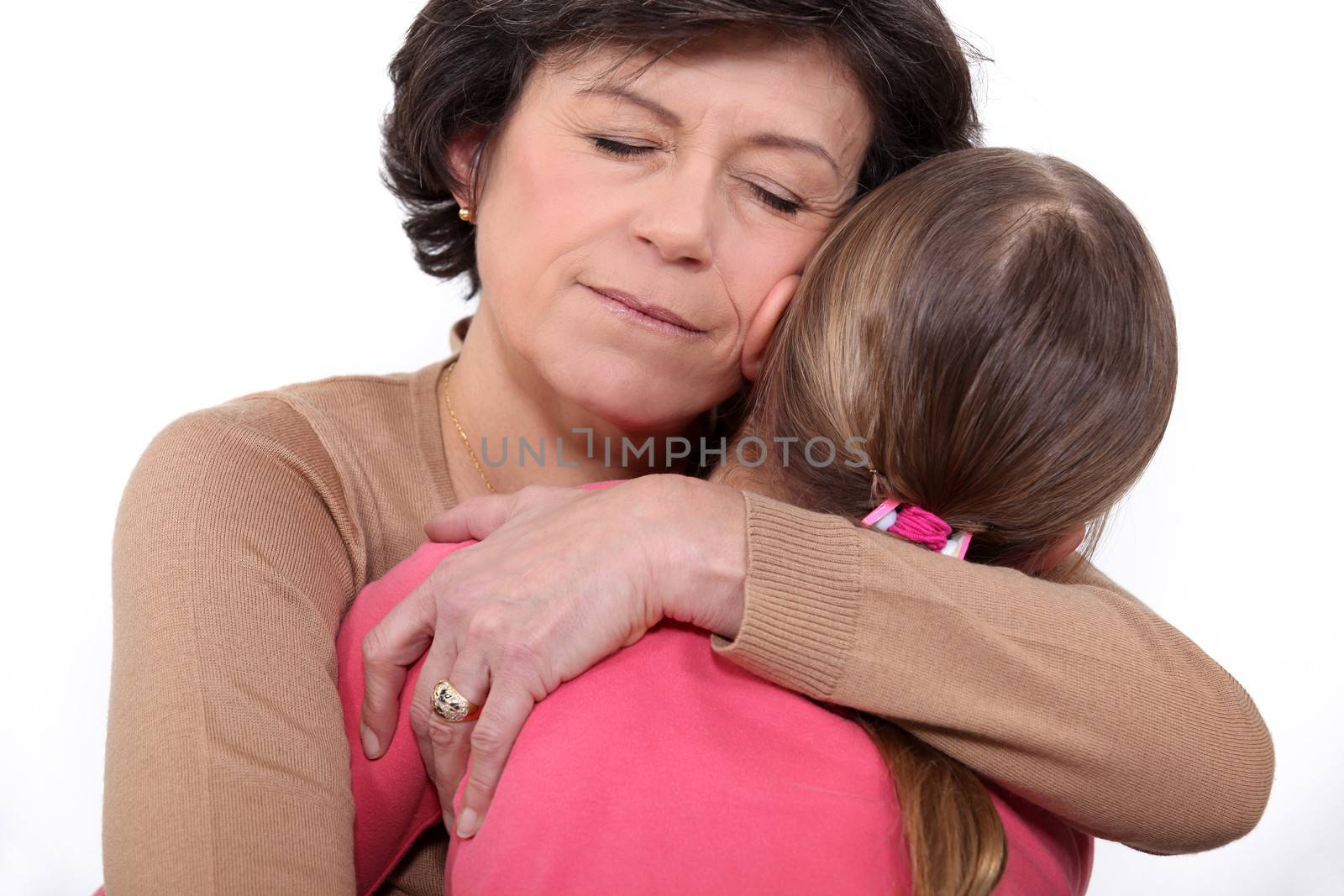 mother hugging daughter by phovoir