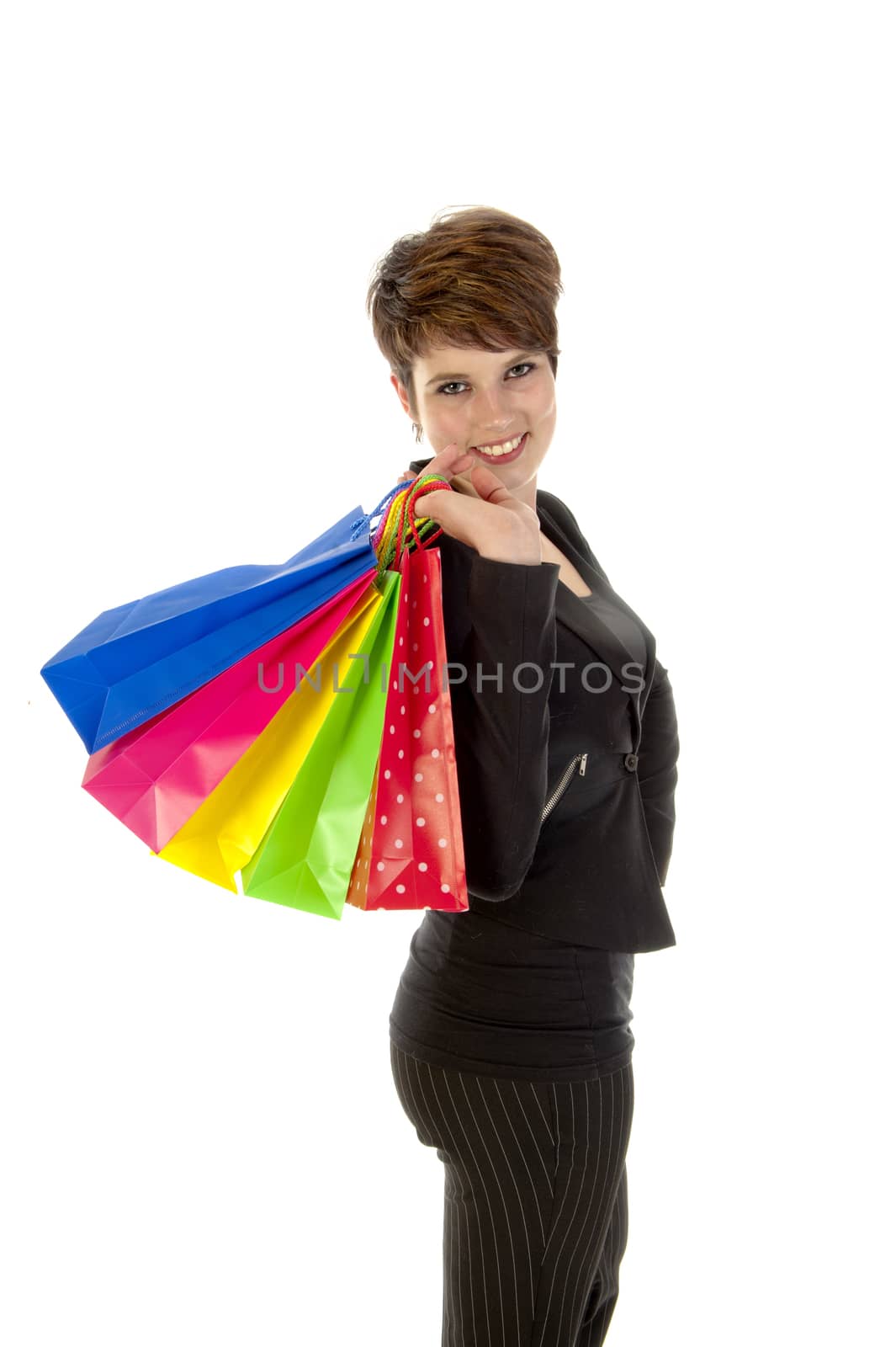 a girl with a lot of shopping bags in all kind of colors