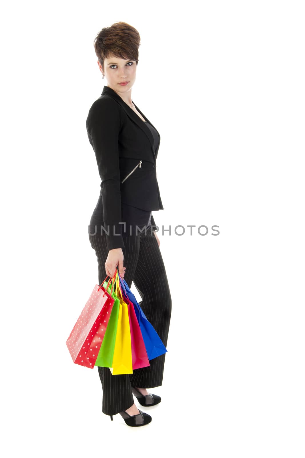 a girl with a lot of shopping bags in all kind of colors