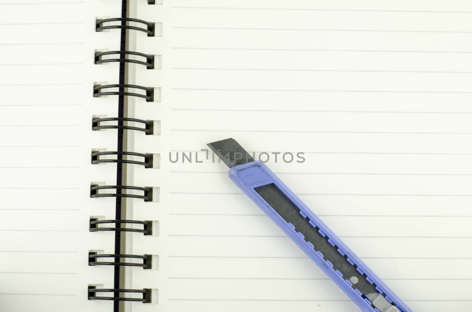 cutter on notebook background texture