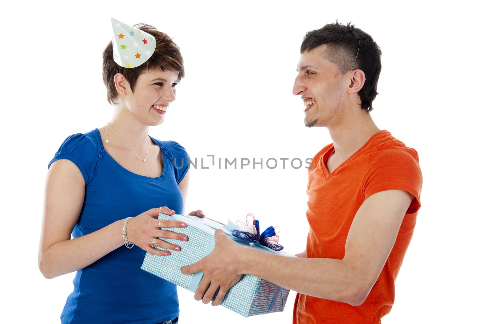 a happy boy is having a present for his birthday girl on a white background