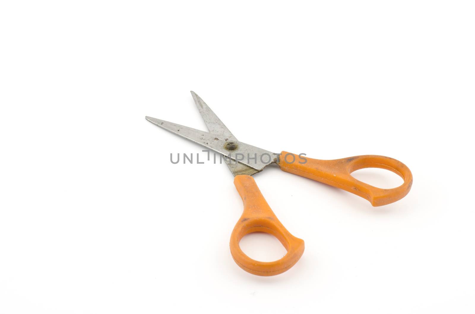 orange used scissors isolated on white  by ammza12