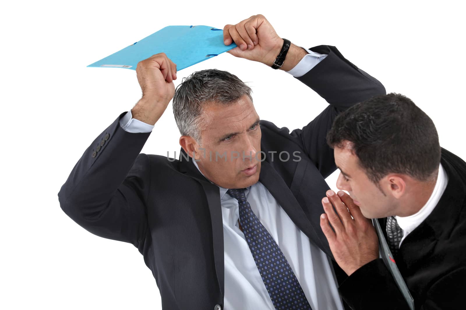 Businessman hitting a colleague by phovoir