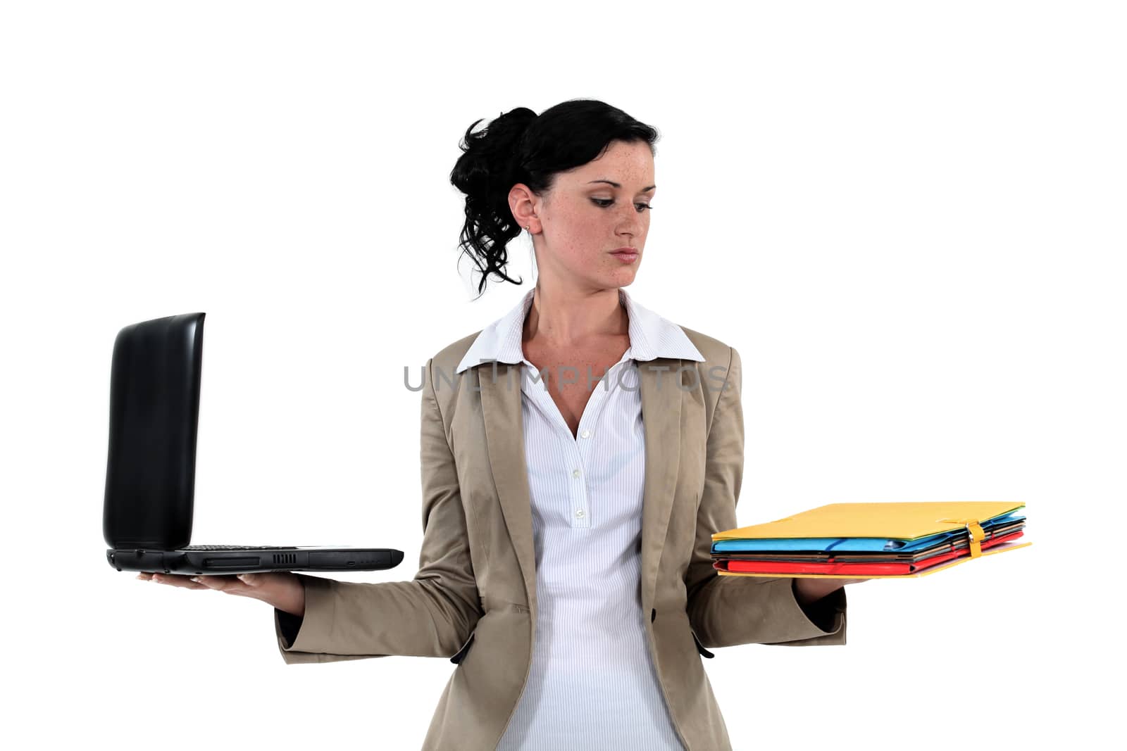 Young woman with laptop and folders in hands