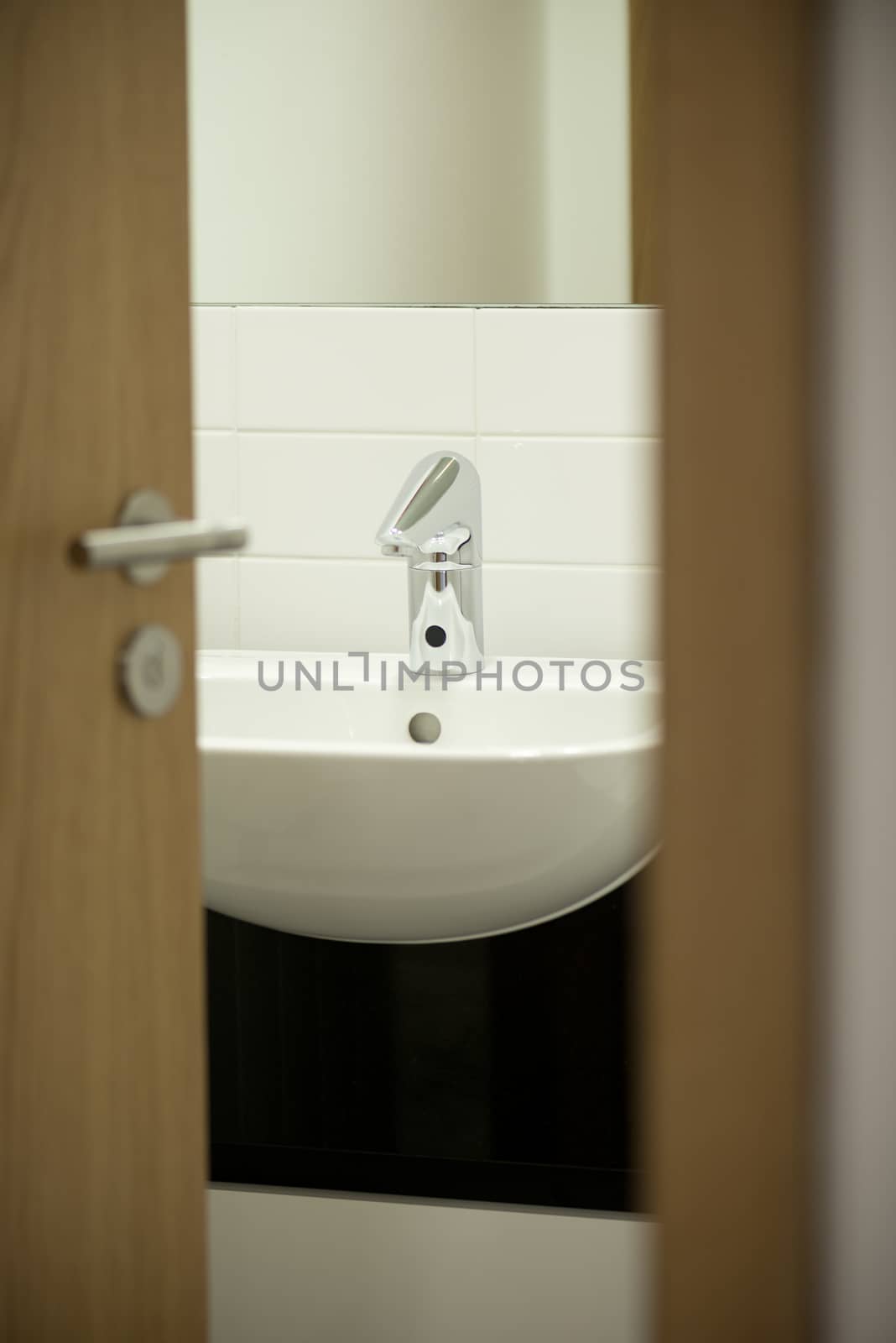 viewing into a bathroom looing at sink with chrome tap