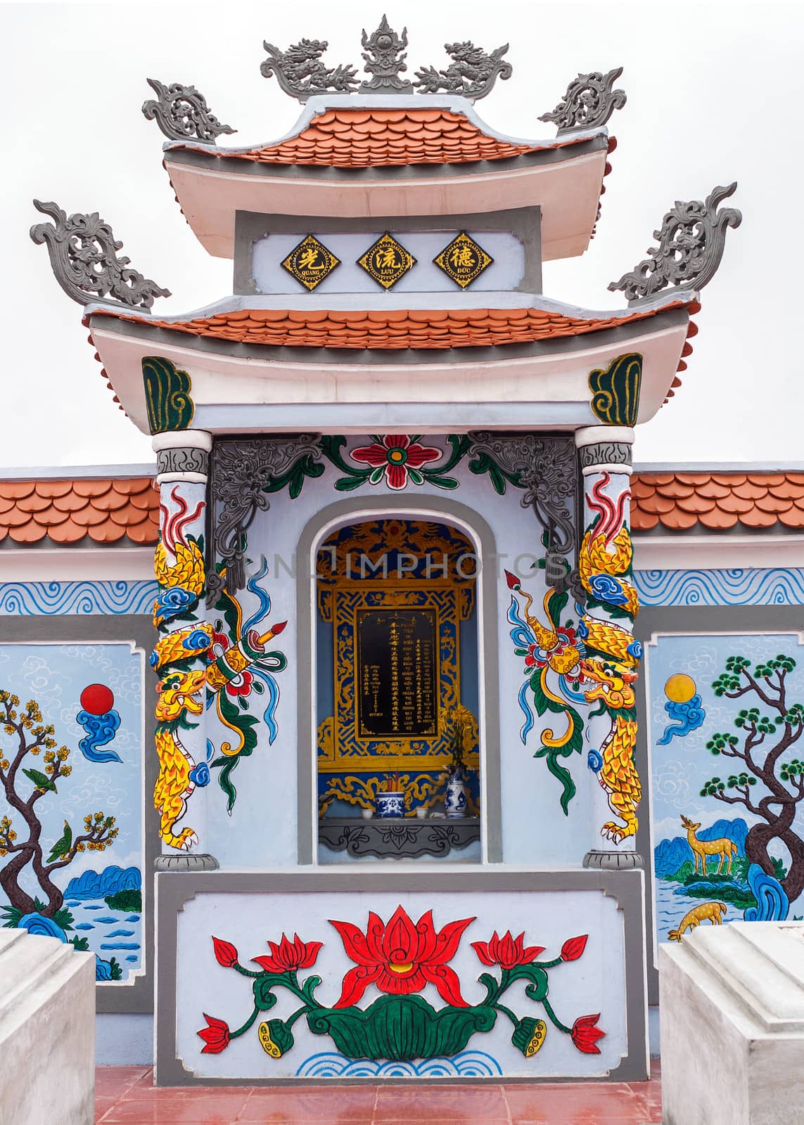 Vietnam Quang Binh Province: Shrine as altar on family grave plot in cemetery. by Claudine