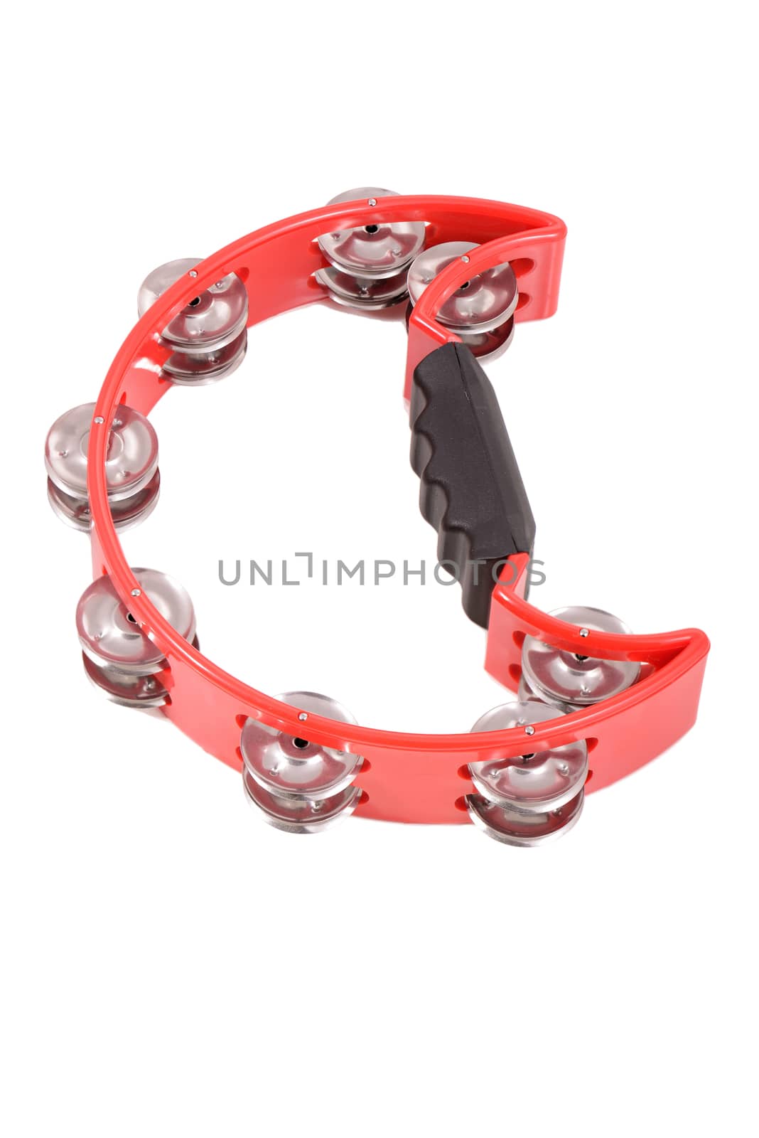 red musical tambourine on white background