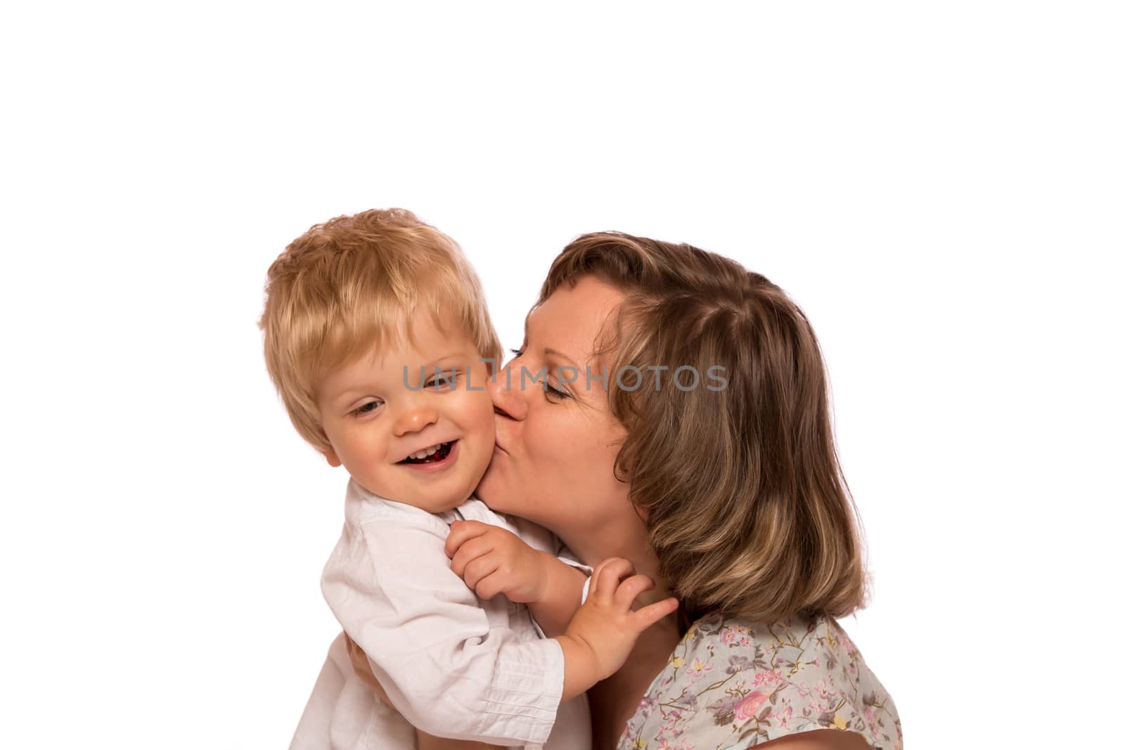 Happy mother embracing her little boy. Isolated on white background